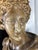A striking and grand-scale mid-century Italian neoclassical chalkware/plaster bust depicting the Apollo Belvedere,...