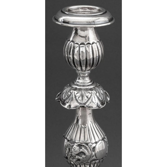 Pair of Russian Judaica Baroque Style Sterling Silver Candlesticks, each with molded floral and foliate design atop a...