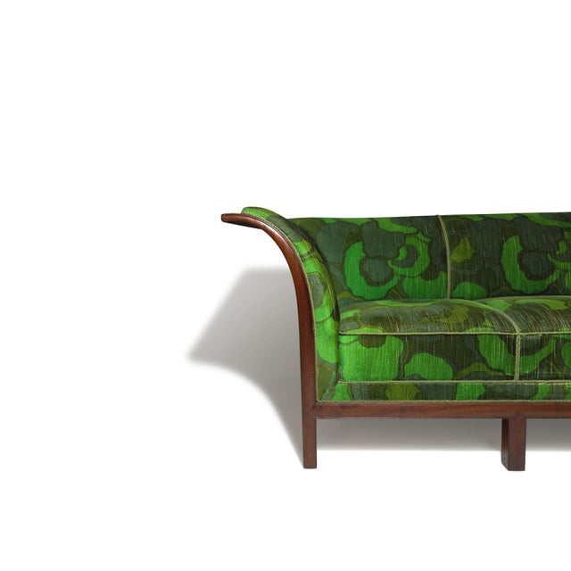Sofa by master cabinetmaker Frits Henningsen, Denmark, 1938. The design features dramatic flared arms crafted from Cuban...