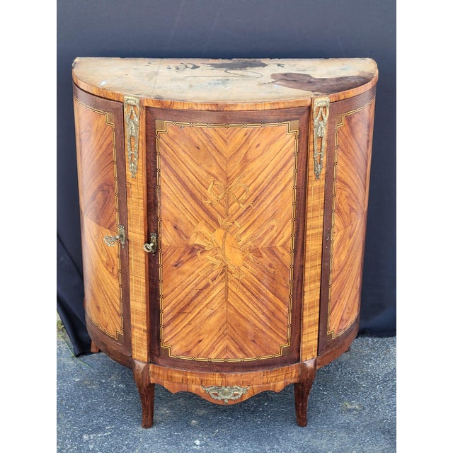 This 19th Century French Marble Top Cabinet Bar/Server is a beautifully crafted antique piece with a brown marble top and...