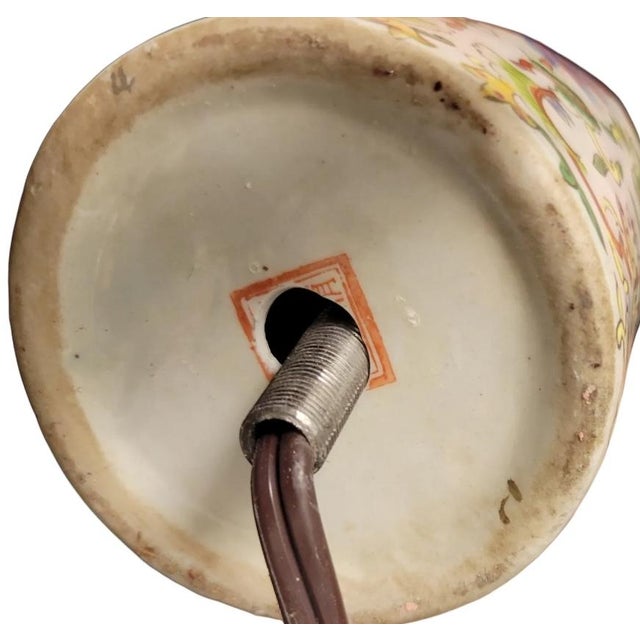 A lovely, antique, Chinese famille rose enamel cylinder vase, converted into a lamp with a storied heritage and...