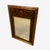 This elegant black and gold–gilded mirror features beautifully bevelled glass that adds depth, light, and refinement to...