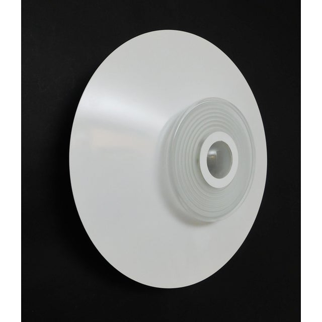 Vintage Italian wall light or flush mount, Model Moni 1190-1200, with white enameled metal shade and glass center...