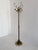 An elegant and highly decorative Italian brass hall tree produced during the 1960s. The design features a twisted brass...
