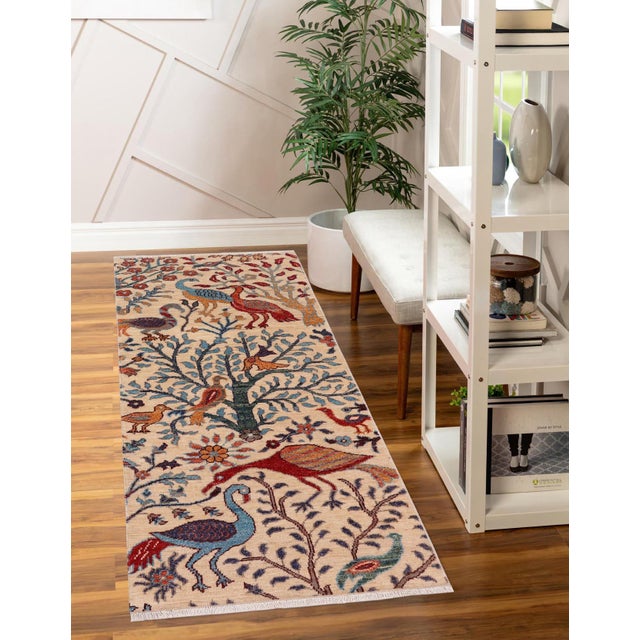 Enhance the ambiance of your home with this magnificent Persian-influenced Turkish hand-knotted rug made by skilled...