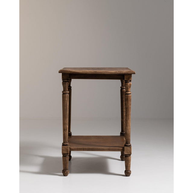 Oak side table with shelf in Weathered Honey Oak. Its weathered honey oak finish sets off turned legs, open lower shelf, a...