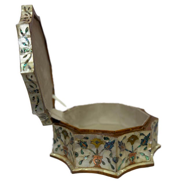 This handmade wooden jewelry box is crafted from solid natural wood and meticulously inlaid with genuine mother of pearl....