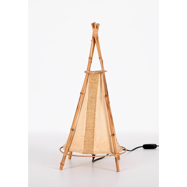 Wonderful Mid-Century American Indian tent-shaped table lamp in bamboo and rattan. This excellent piece was made in Italy...