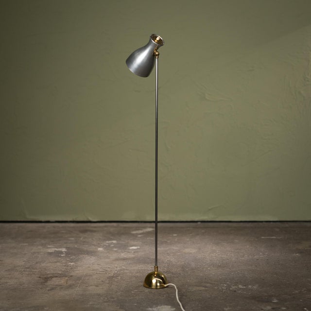 This floor lamp was produced by the Swiss manufacturer Wohnbedarf AG in the late 1950s and is based on a design by Dieter...