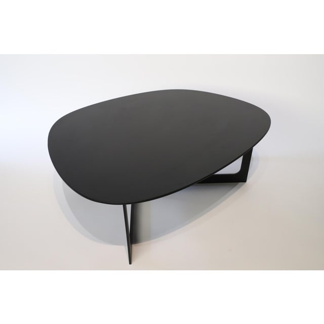 The Insula Cocktail or End Table designed by Ernst & Jensen for Erik Jorgensen is a stunning piece that seamlessly blends...