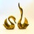 A pair of large mid century brass swans. Sleek modernist silhouettes. Great sculptural statement pieces. Measurements:...