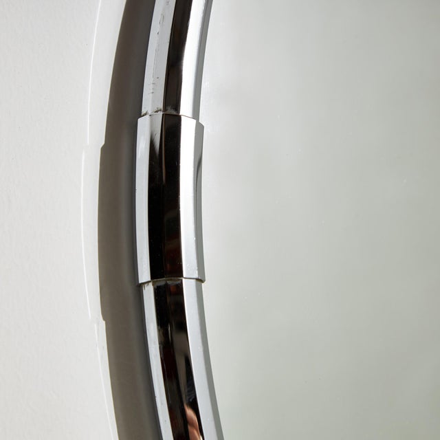 Large circular metal framed mirror from the 1980s. The mirror frame has surface scratches, stains and wear in places.