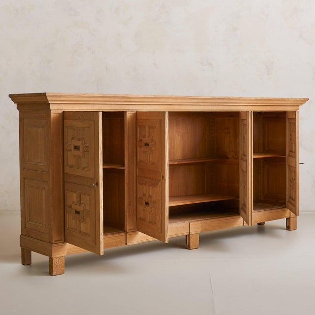 Crafted in Spain during the 1940s, this 10-foot-wide cabinet is a masterclass in craftsmanship, commanding attention with...
