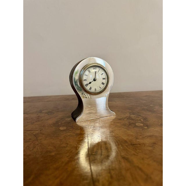 Stunning quality antique silver hallmarked mantle clock, having a quality antique silver mantle clock with a circular...