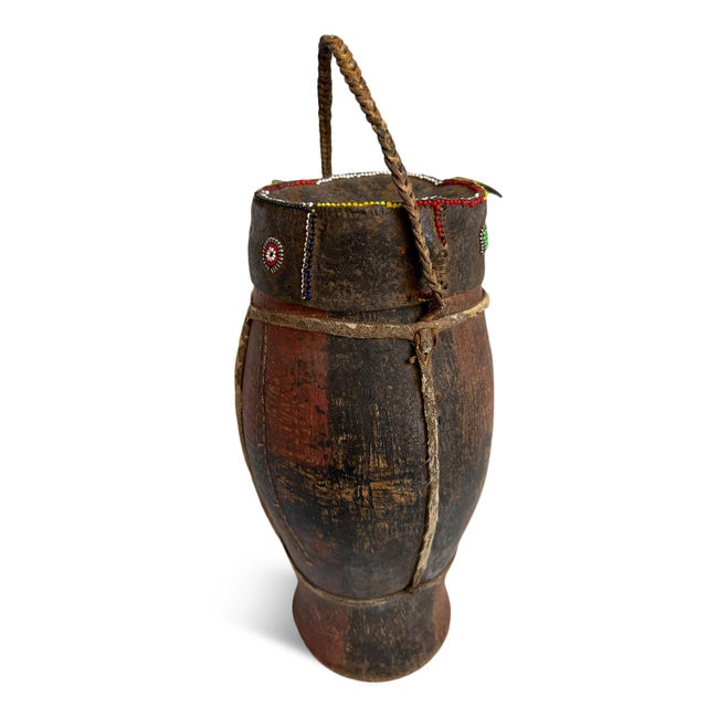 Old and rare original herbal medicine container from Kenya. Carved wood with worn red and black pigments. Animal skin...