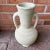 Beautiful, rustic terracotta / clay vessel featuring 2 handles and a chalky neutral toned matte, “white clay” finish. It...