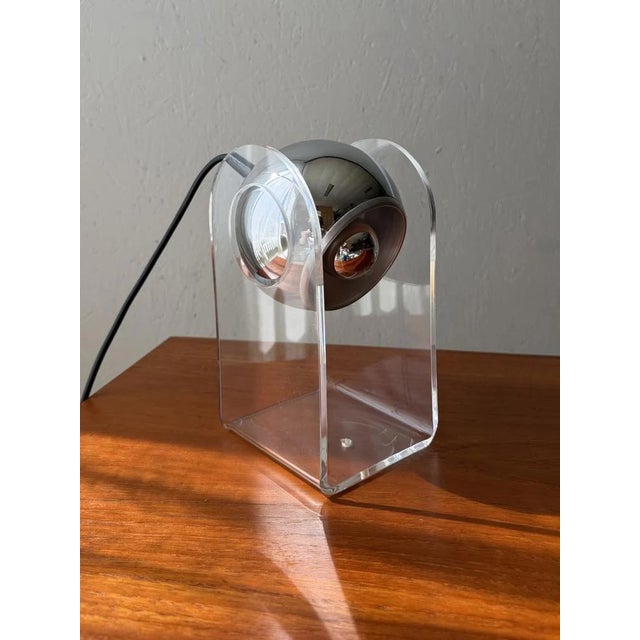 This Sensorette table lamp was manufactured in the 1970s by the German company Insta GmbH. The design is inspired by the...