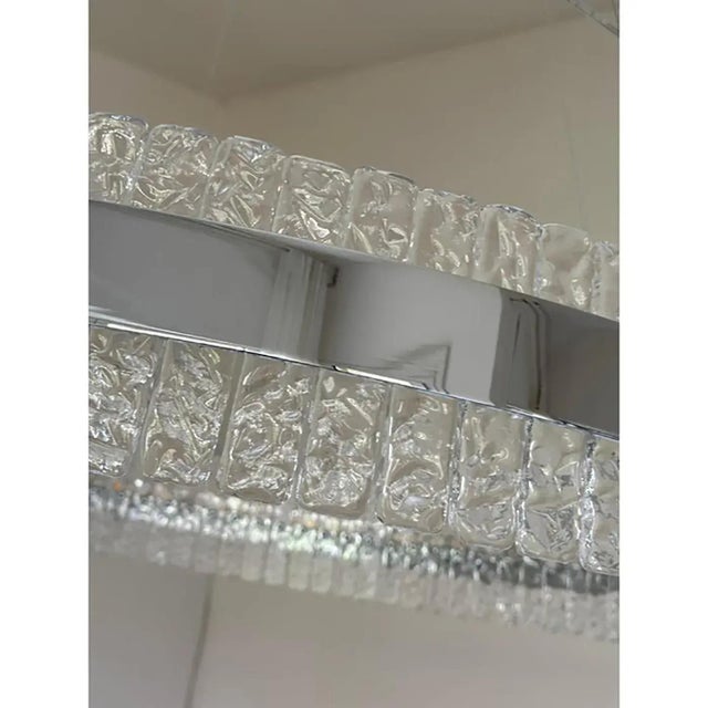 Contemporary polished kromo ring chandelier with hammered clear "ice" murano glass with strip led. the " ice" element in...