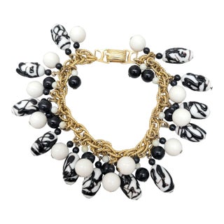 Vintage Signed Napier Book Piece Goldtone Zebra Bead Charm Bracelet, 1967 For Sale
