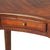 This elegant Writing Desk features a crescent shape tabletop supported by four stylized, tapered cabriole legs and a...