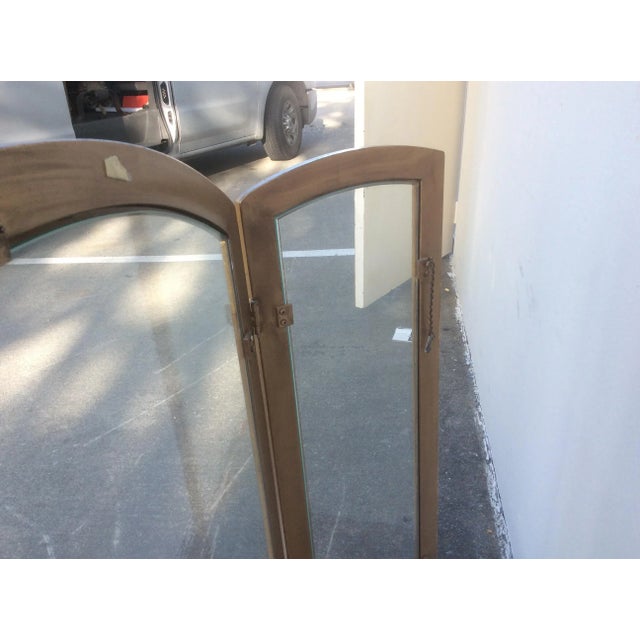 Classic glass. And Gilt metal three panel fire screen. The side panels are eleven inches wide each and the center panel is...