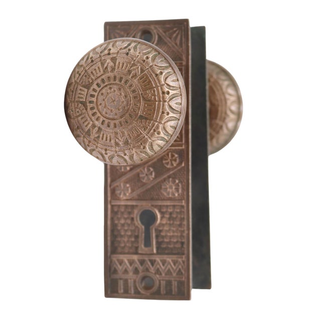 Antique 1880s Vernacular style door knob set made of bronze with a patina finish. The original mounting screws are not...