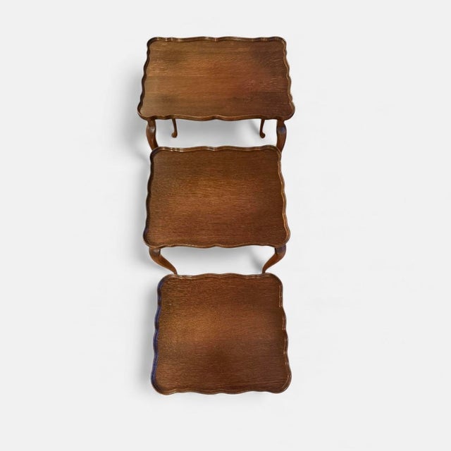 Queen anne–inspired danish nesting tables with scalloped edges set of three nesting tables crafted in wood, denmark c....