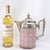 A striking Victorian-era coffee pot that features a vibrant, heavy base metal body expertly enameled inside and out. The...