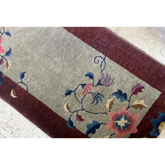 A charming and sophisticated example of the Chinese Art Deco period, this hand-knotted wool rug dates to the 1920s. The...