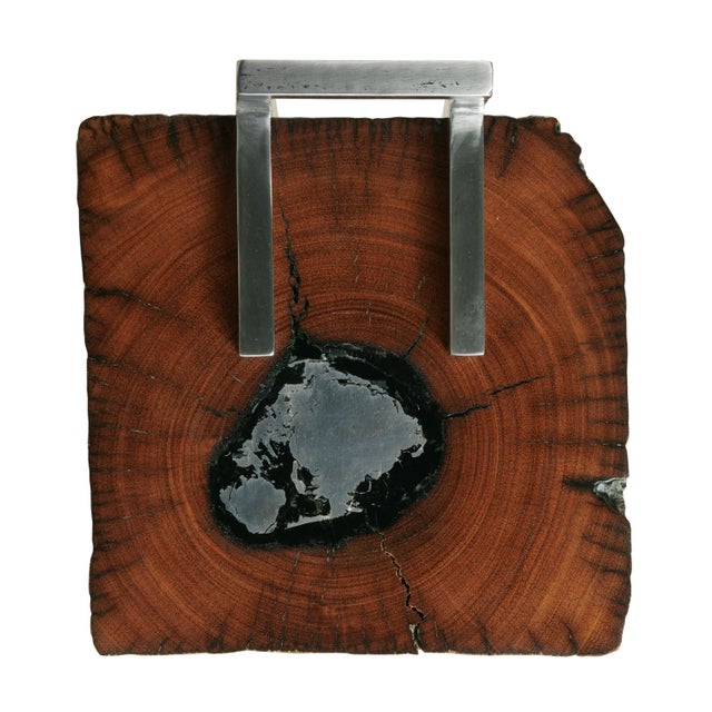 Reclaimed oak with cast aluminum accent top with textured finish steel frame; Designed by Pride Sasser Dust with a soft,...