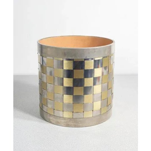 Italian-designed magazine holder vase, two-tone chrome metal, silvered and gilded origin italy period 1970s. material two-...