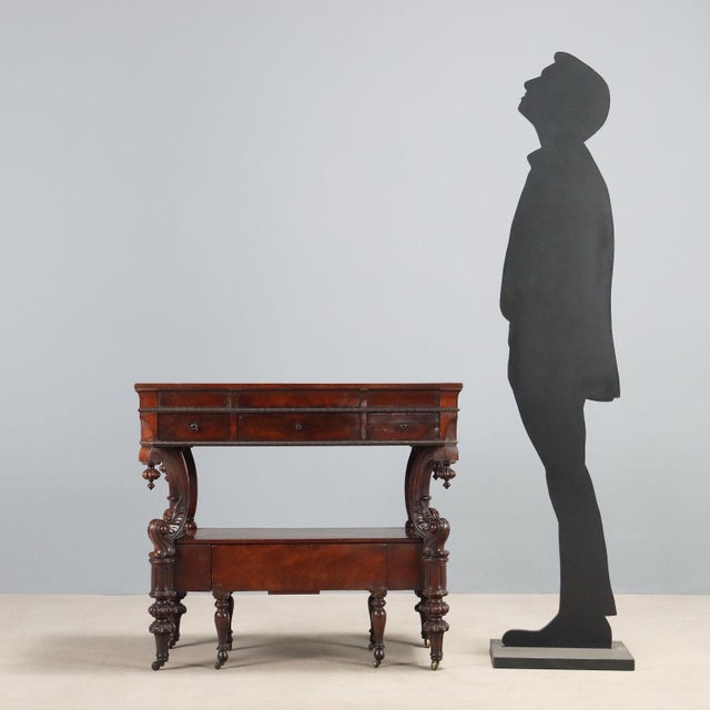 Louis Philippe mahogany dressing table. Three drawers in the lower section, supported by four curved legs carved with...