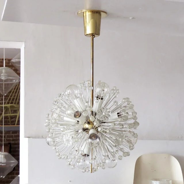 Beautiful and delicate sixteen-light brass fixture by Emil Stejnar for Nikoll with copious amounts of Austrian crystals,...