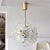 Beautiful and delicate sixteen-light brass fixture by Emil Stejnar for Nikoll with copious amounts of Austrian crystals,...