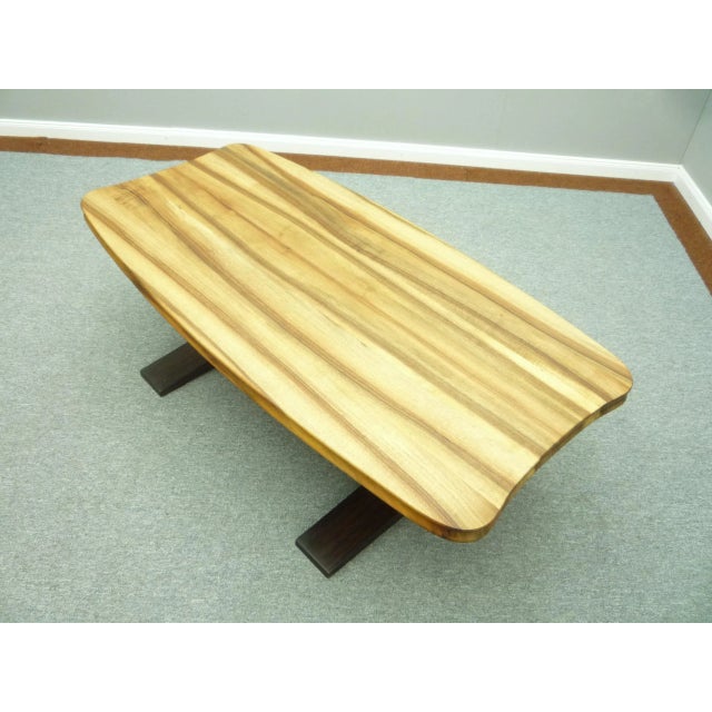 Wonderful Art Deco coffee table. First owner and bought in the 30s. The table top is very shapely with a great veneer....