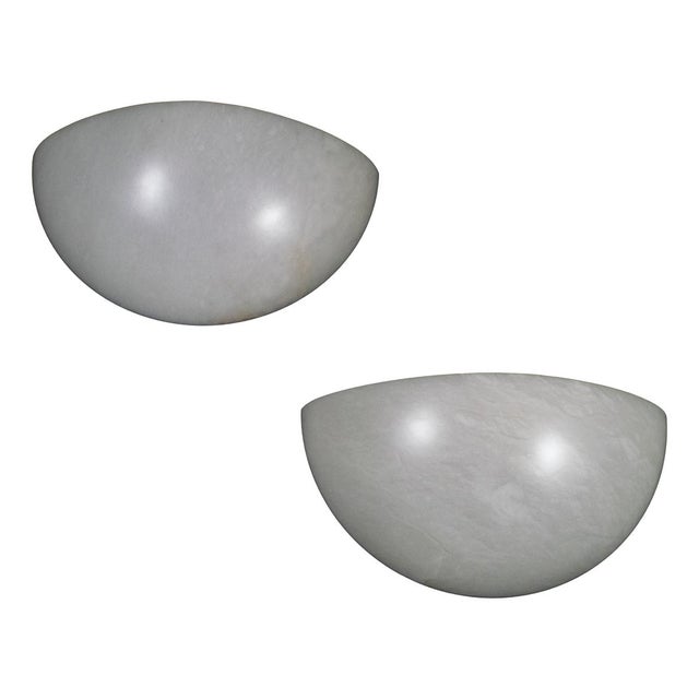 Pair of Art Deco inspired Spanish alabaster sconces. Each piece displays naturally occurring variations in color and veining.