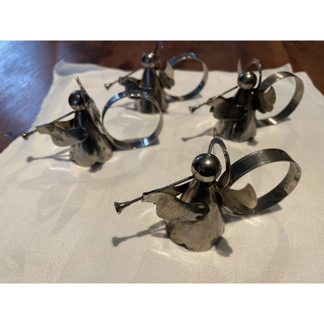 Set of 4 Silver Plated Angel Playing Horn Napkin Rings. These beautiful Christmas Decorations are silver plated over...