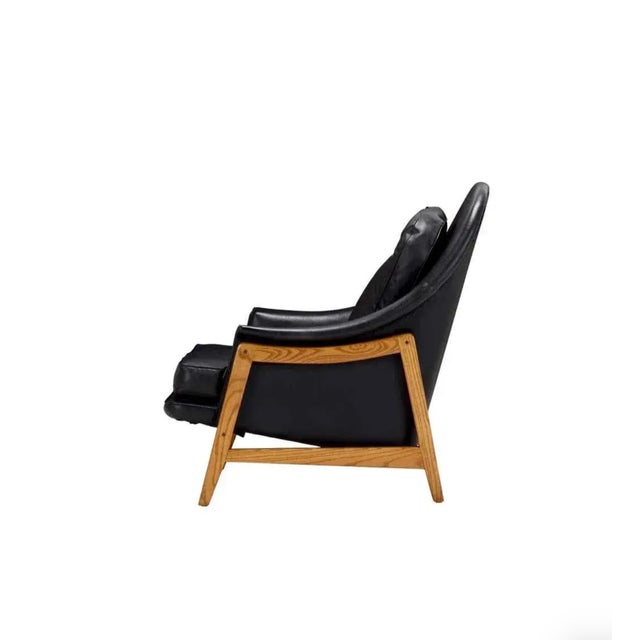 Edward Wormley black leather Janus lounge ch air, Model 5701, Dunbar, 1957 ash, leather; 33.75 H × 30.5 W × 34 D in;...