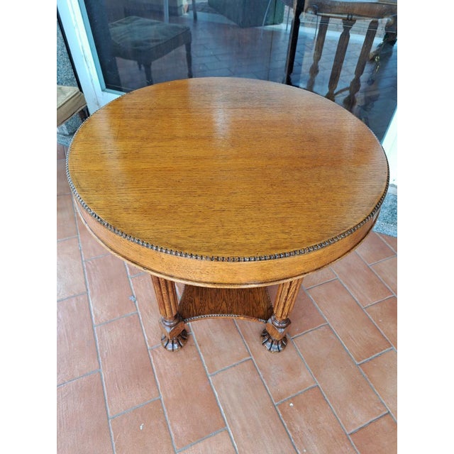 Round oak coffee table – English, restored. Elegant round coffee table from England, crafted from oak and featuring a...