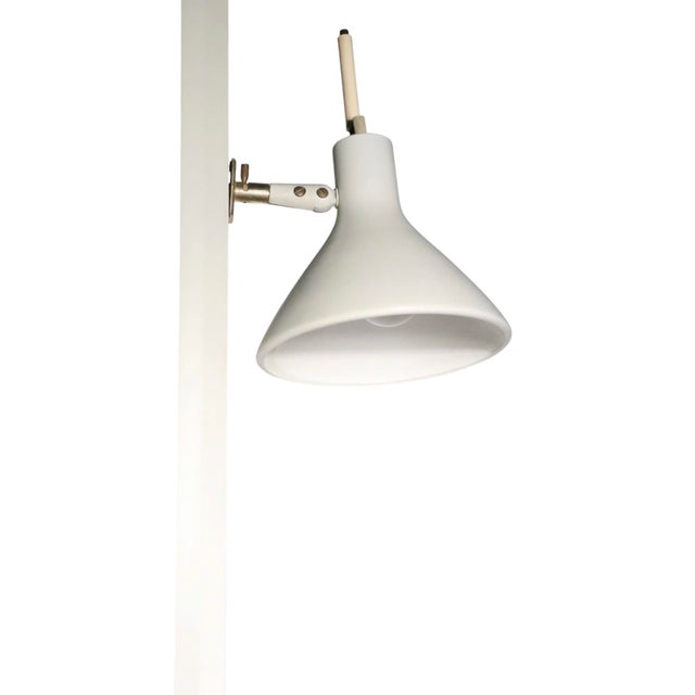 Architectural Mid Century tension pole floor lamp, designed by Gerald Thurston, circa 1950/60's. The lamp features a...