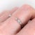 This dainty open band design would look beautiful stacked with a vintage style ring! Adorned with milgrain detailing and...
