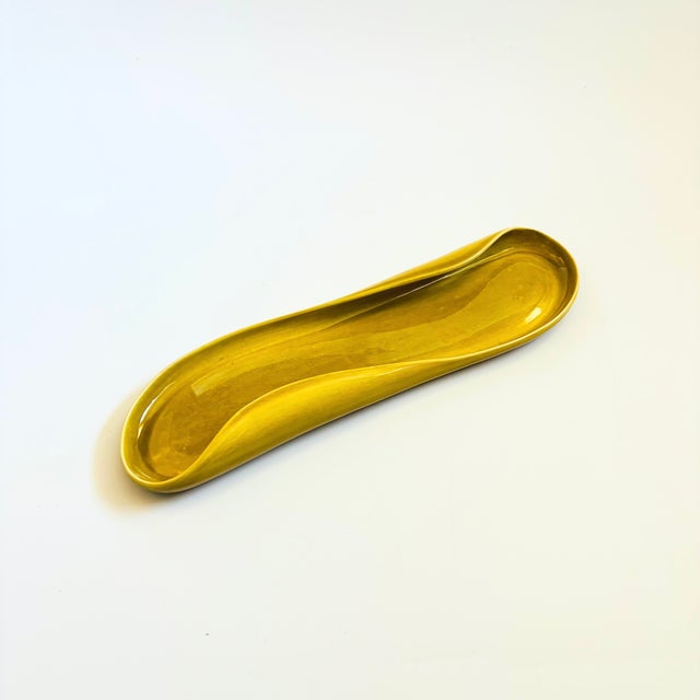 A mid century ceramic celery plate from the "American Modern" dinnerware line designed by Russel Wright. Manufactured by...