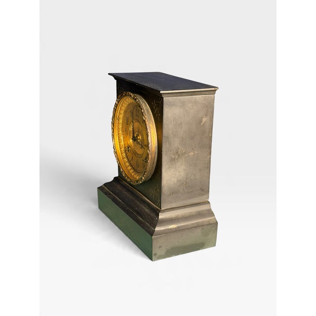 Antique cast iron mantel clock produced by the Ansonia Clock Company. Dating back to the late 19th or early 20th century...