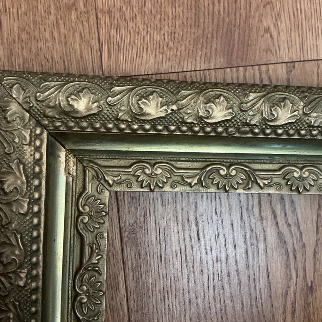 Late 19th Century American Victorian Ornate Giltwood and Gesso Picture Frame. The frame has his high dimensionality of its...