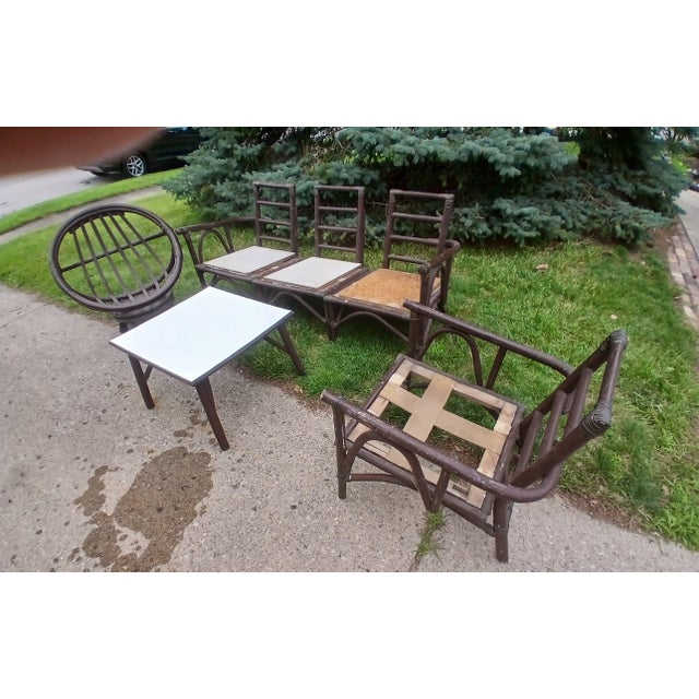 Vintage 1970 real bamboo patio set. Set of 4 pieces! Includes a swivel chair, side chair, coffee table and 3- piece sofa....