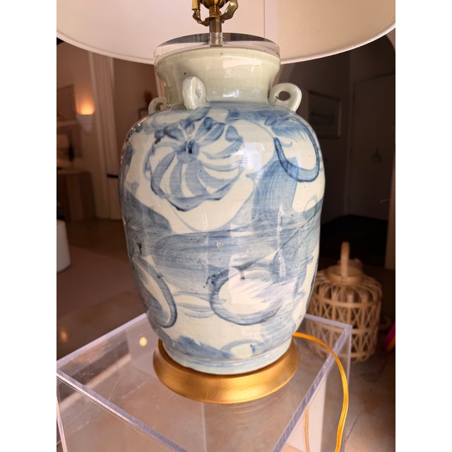 This striking table lamp blends coastal, transitional, and contemporary design influences with a timeless artisan feel....