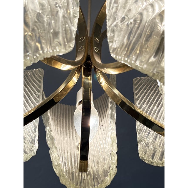 Crafted by the renowned j.t. Kalmar in vienna, austria, this exceptional chandelier features four exquisitely textured...