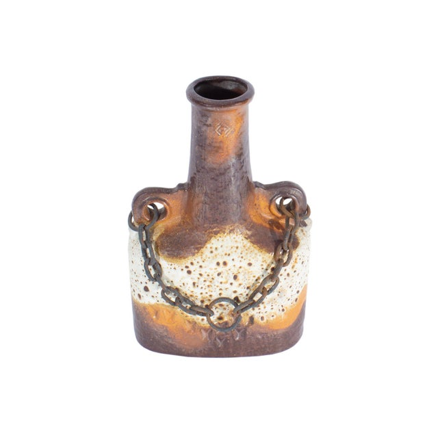 A West German ceramic "Luxus" vase produced by Carstens Tönnieshof. This mid-century vase features a brown and beige glaze...