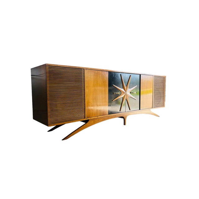 Stereo Cabinet in Walnut in the Manner of Vladimir Kagan, USA, c 1960s This extraordinary Mid Century Modern sculptural...