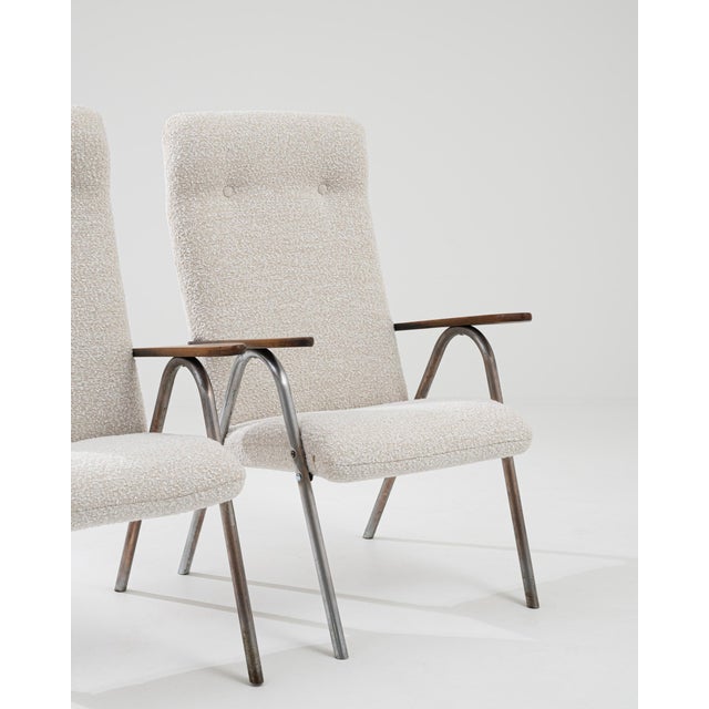 With their clean, graphic form, this pair of vintage armchairs offer an impeccably stylish accent. Made in the 20th...